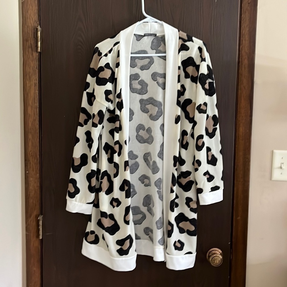 Hemish U.S.A long sleeved long animal patterned sweater. Size Large. NWOT